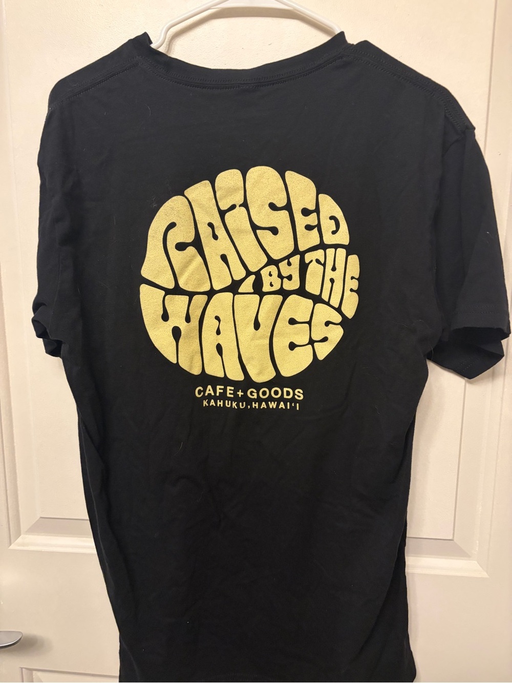 Black Tee with Yellow 'Raised By The Waves' Graphic